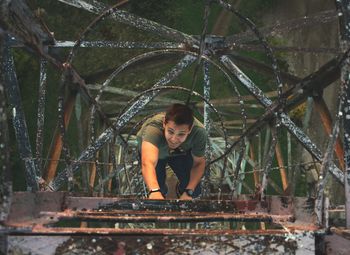 Full length of young man looking up