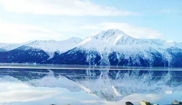 mountain, snow, cold temperature, scenics, mountain range, winter, nature, lake, beauty in nature, reflection, sky, tranquil scene, frozen, water, ice, tranquility, no people, outdoors, cloud - sky, waterfront, snowcapped mountain, day, landscape, tree, iceberg