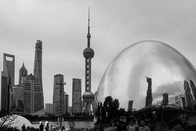 Panoramic view of buildings in city against sky