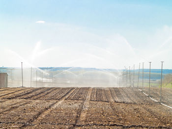 Scenic view of farm against sky