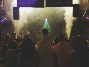 Rear view of people enjoying music concert