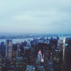 Cityscape against cloudy sky