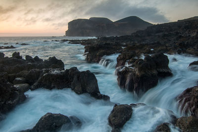 Beautiful rock structures at sunset in the coastline of island of faial in the azores