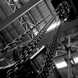 Low angle view of illuminated lighting equipment hanging on railing