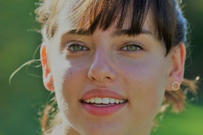 Close-up portrait of smiling young woman