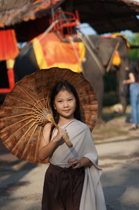 Portrait of woman standing outdoors