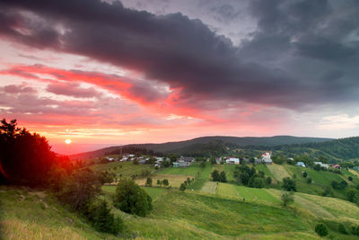 Scenic view of landscape against sky during sunset