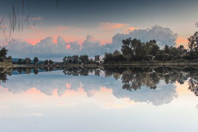 Scenic view of lake against sky during sunset