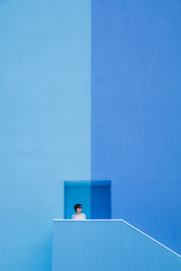 View of buildings against clear blue sky