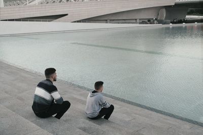 High angle view of men sitting on floor