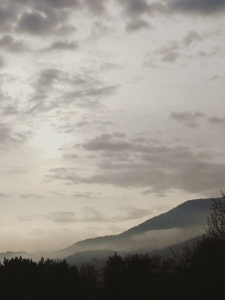 mountain, tranquil scene, scenics, tranquility, beauty in nature, silhouette, landscape, mountain range, nature, idyllic, sky, majestic, cloud - sky, non-urban scene, fog, cloud, remote, atmosphere, calm, outdoors, cloudscape, foggy, atmospheric mood, day, physical geography, outline, dawn, land feature