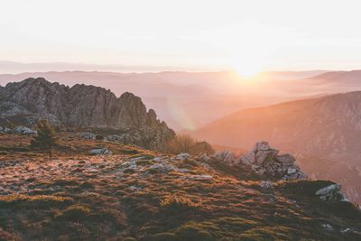 Scenic view of mountains against sky during sunset