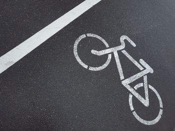 High angle view of bicycle sign on road
