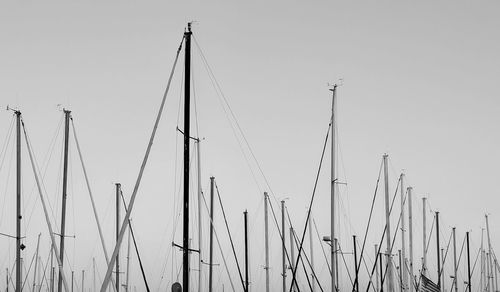 Low angle view of sailboats against clear sky