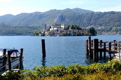 Scenic view of lake and mountains against sky