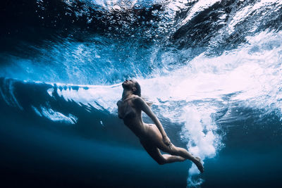 Woman swimming in sea