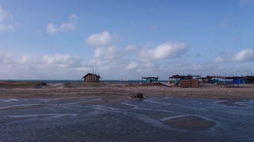 Scenic view of beach against sky