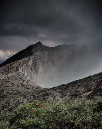 Scenic view of volcanic mountain against sky