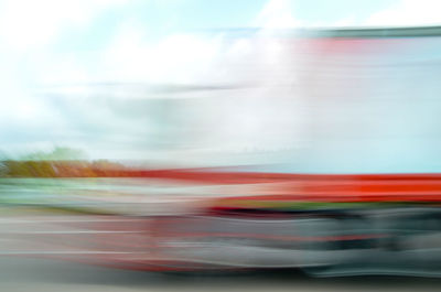 Blur image of truck on road