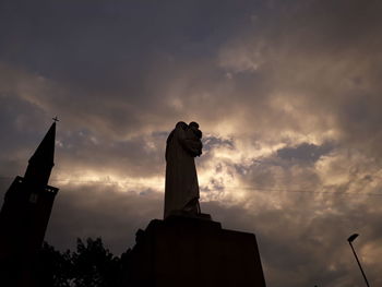 Low angle view of statue against sky