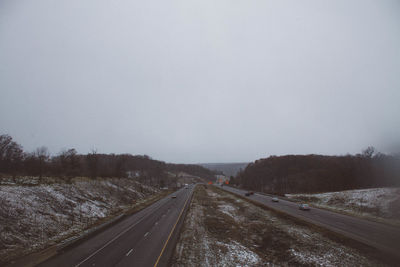 View of railroad tracks against sky during winter