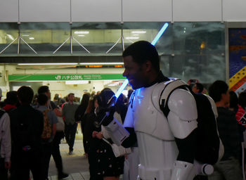 People standing in illuminated room