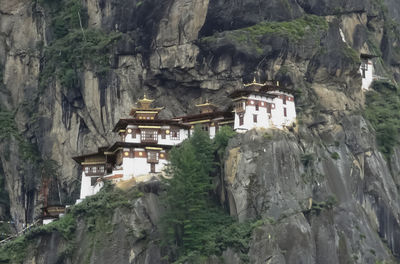 Panoramic view of trees and temple against sky