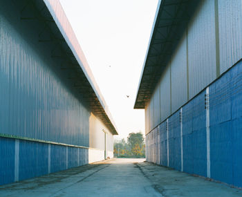 Empty alley amidst buildings in city