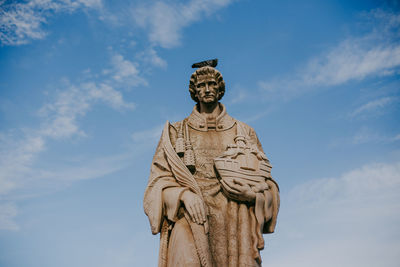 Low angle view of statue against sky