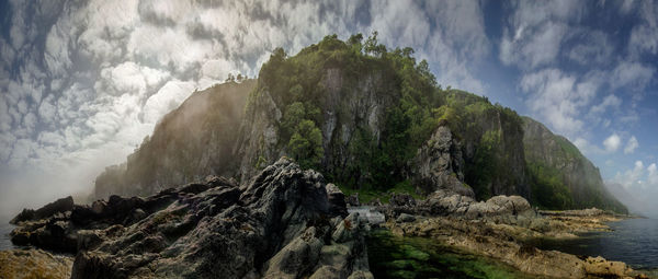 Panoramic view of rocky mountains against sky