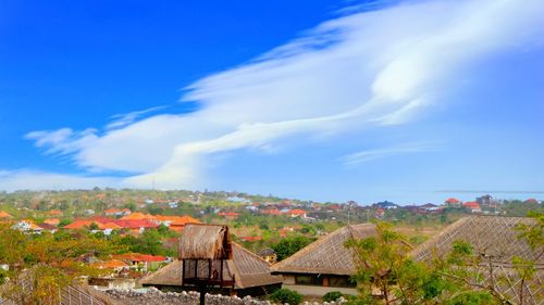 Houses and buildings against sky