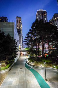 High angle view of illuminated buildings in city at night