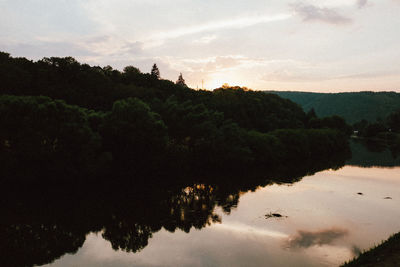 Scenic view of lake against sky during sunset