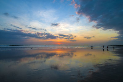 Scenic view of sea against sky at sunset