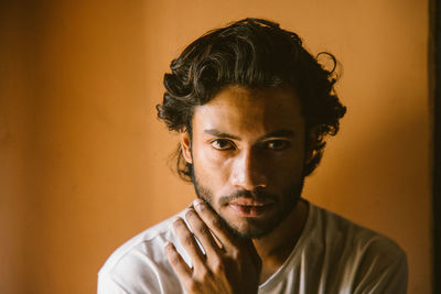 Portrait of young man against colored background