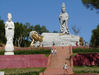 Statue of buddha against sky