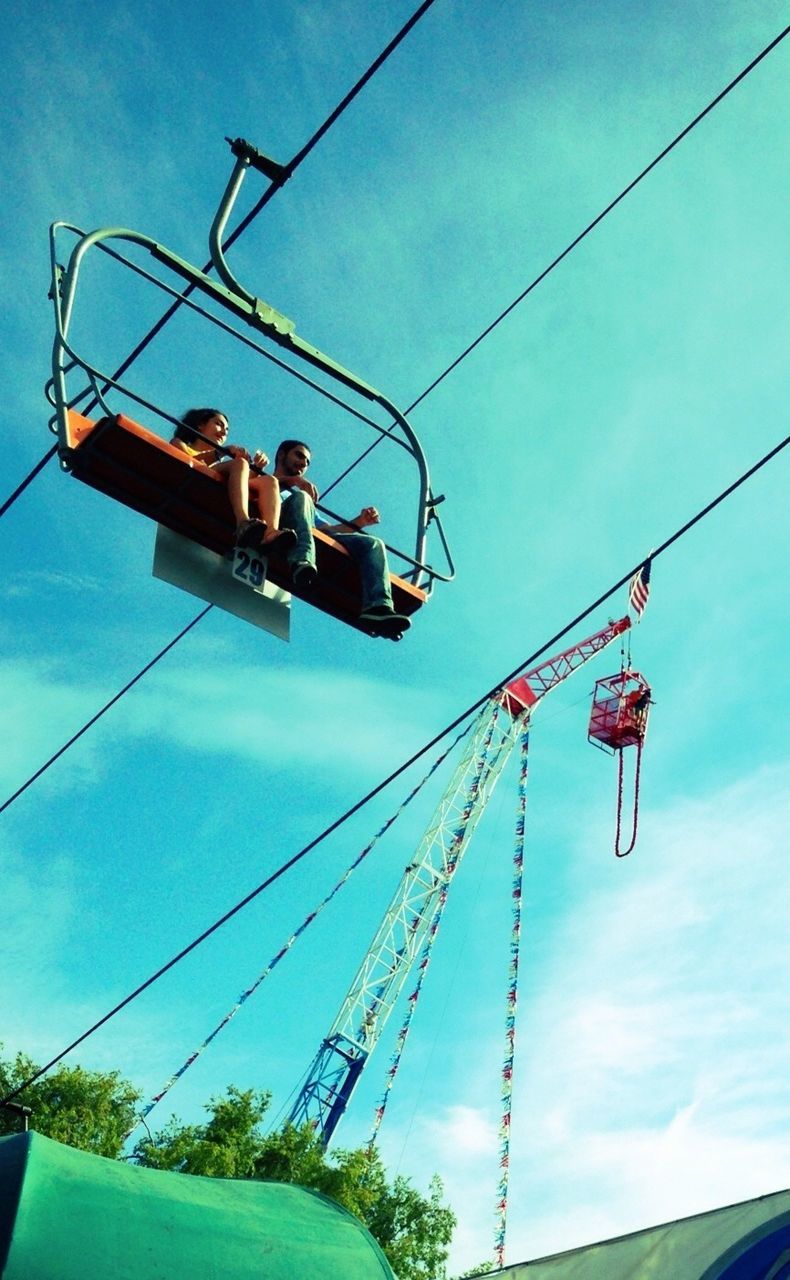 transportation, low angle view, mode of transport, sky, blue, nautical vessel, power line, technology, electricity, cable, men, cloud - sky, connection, power supply, day, outdoors, rope, mast, travel