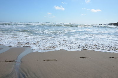 Scenic view of beach against sky