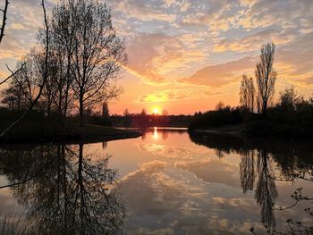 Scenic view of lake against sky during sunset