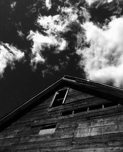 Low angle view of building against cloudy sky