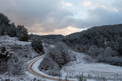 Scenic view of mountains against sky during winter