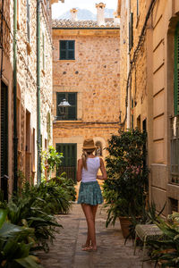 Rear view of woman walking on street