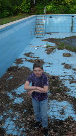 Portrait of smiling boy standing outdoors