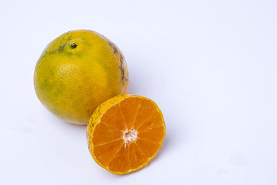 Close-up of orange against white background