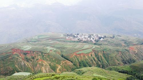 High angle view of terraced fields during foggy weather