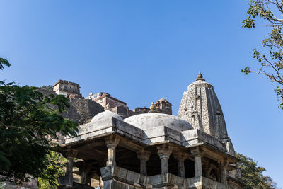 Low angle view of building against clear blue sky