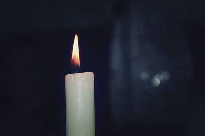 Close-up of lit candle