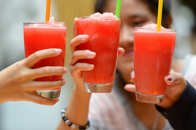 Close-up of woman drinking glasses