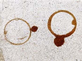 Close-up of heart shape on sand