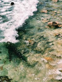 High angle view of rocks in sea